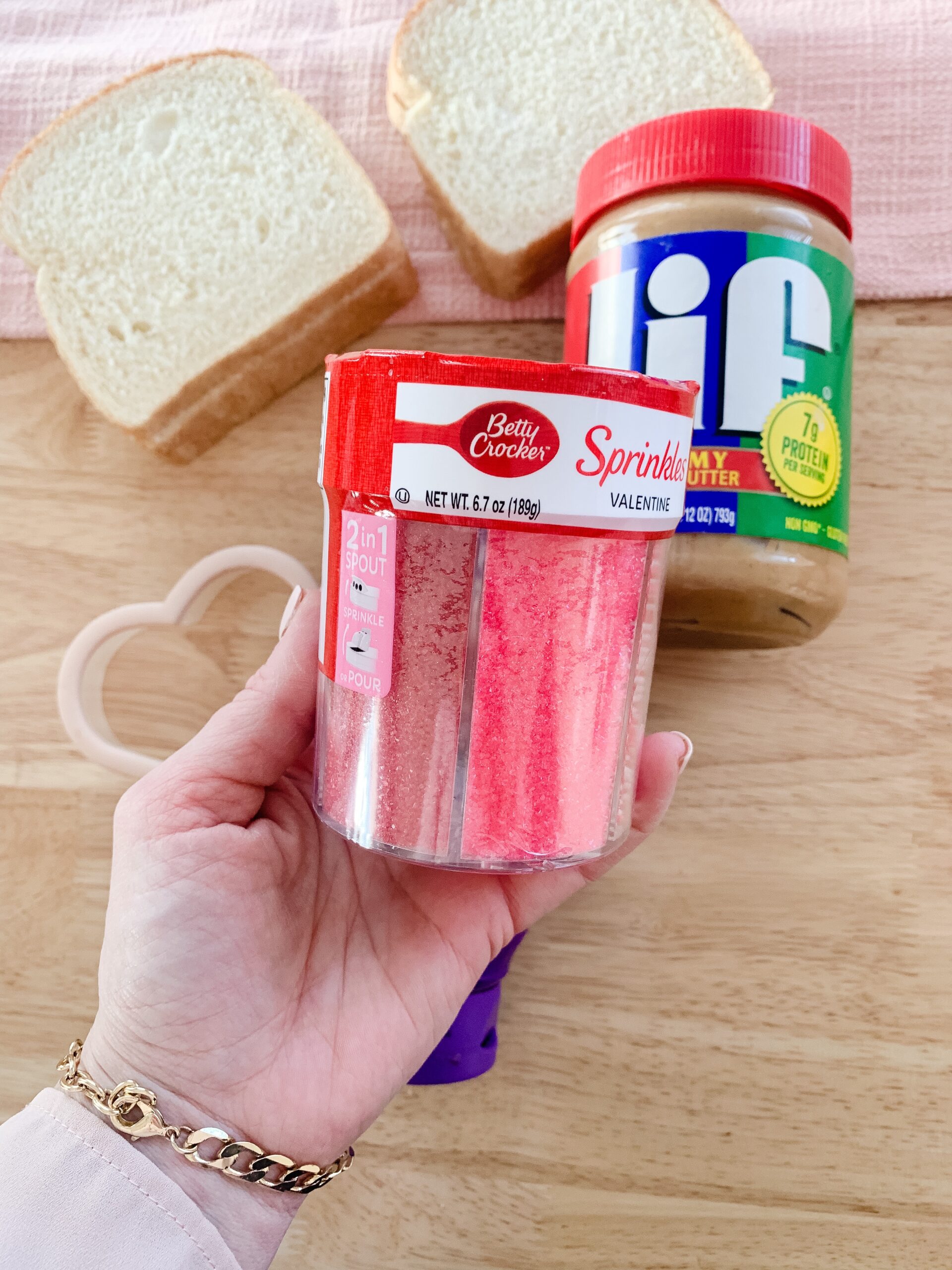 Making Valentine's Day peanut butter and jelly sandwiches