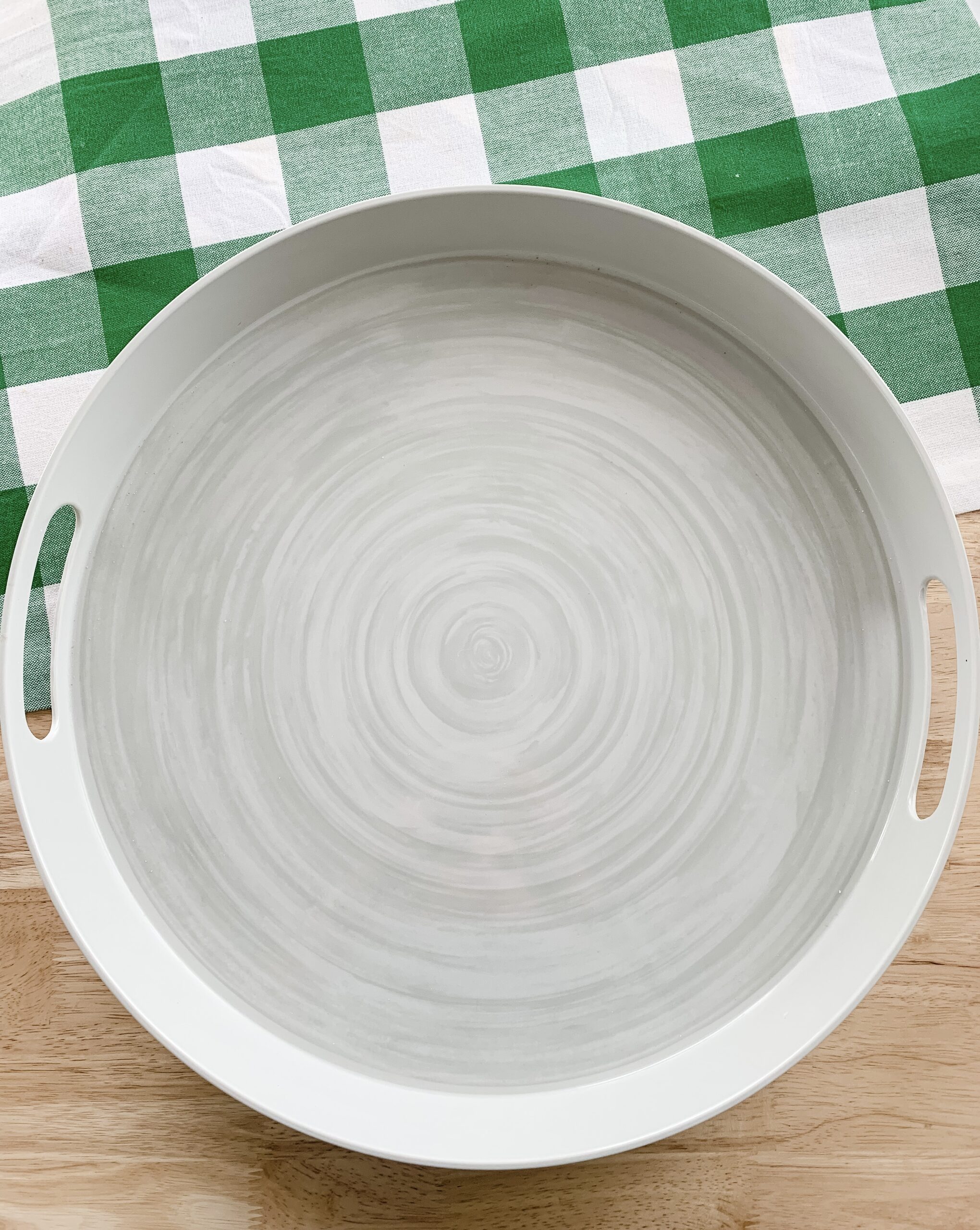 large handled platter on wooden table