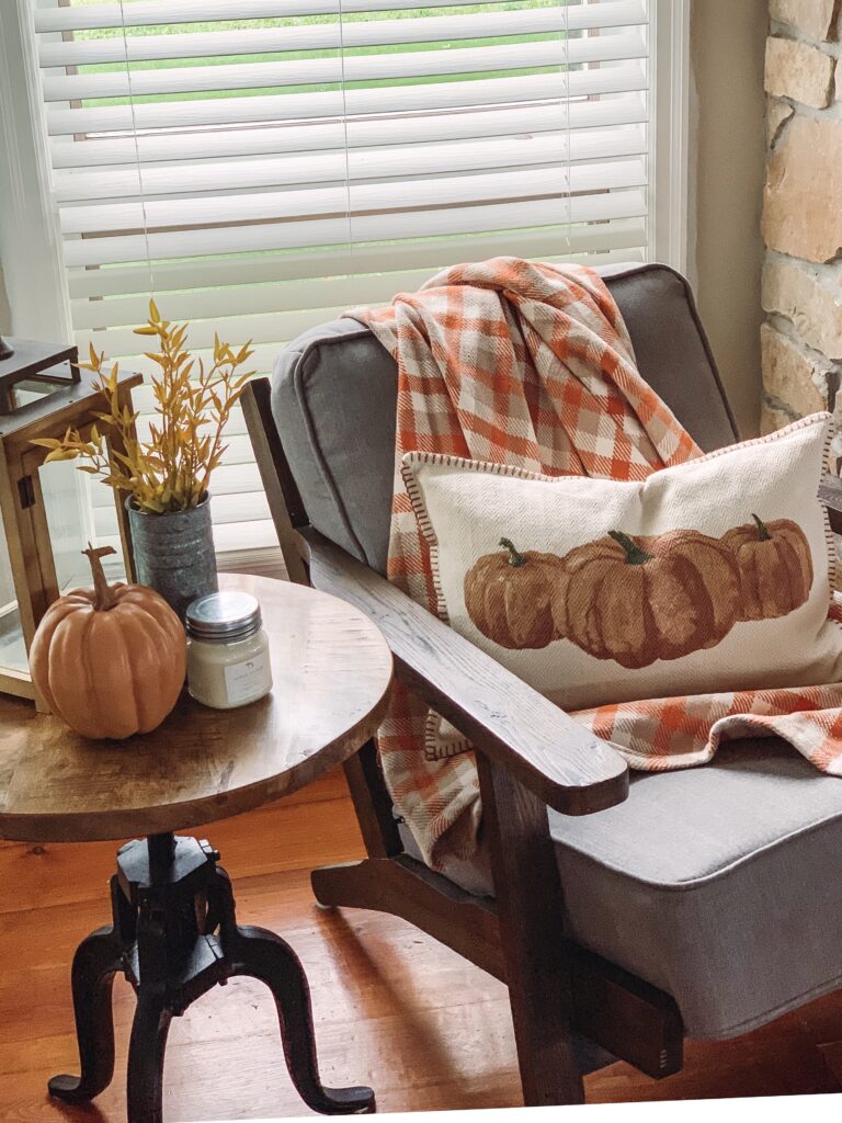 pumpkin pillow in cozy fall decor