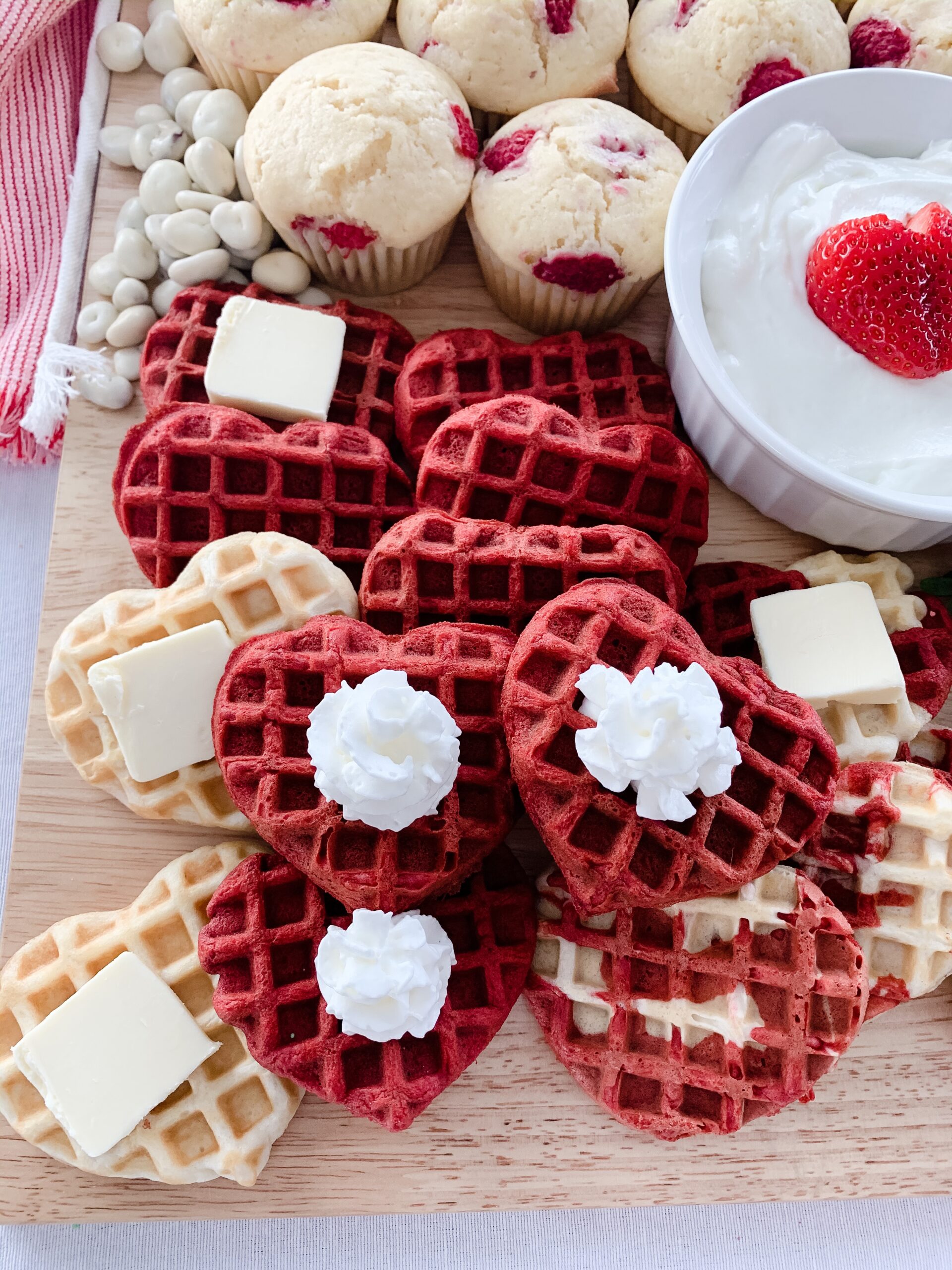 heart shaped waffles on a valentine breakfast board