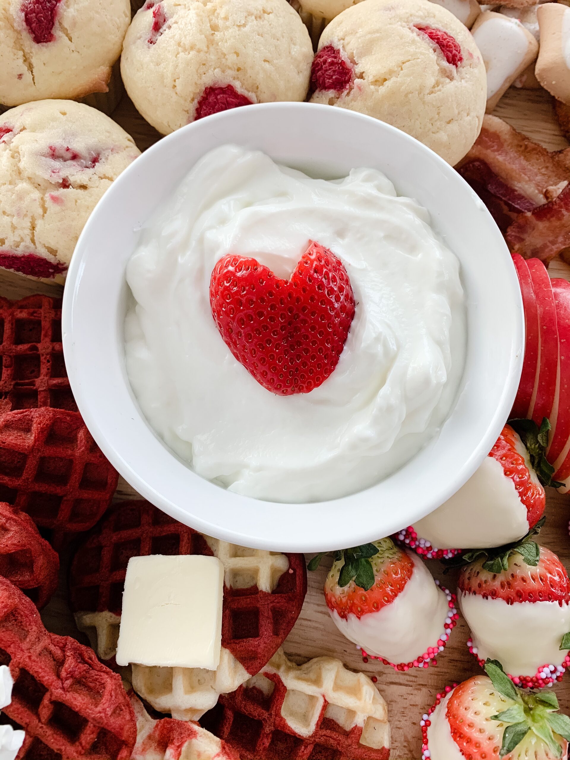 heart shaped strawberry in yogurt