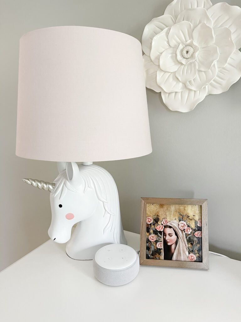 Echo dot on girl's dresser by Mary painting