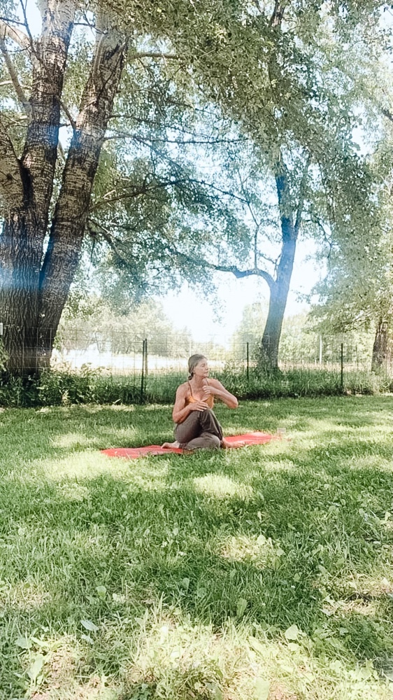 yoga teacher under tree