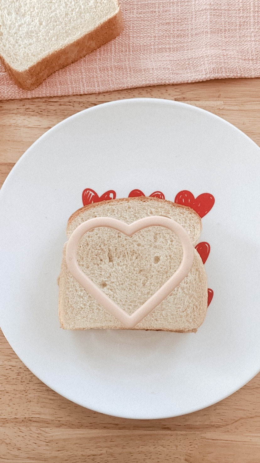 heart shaped cookie cutter on top of bread for Van